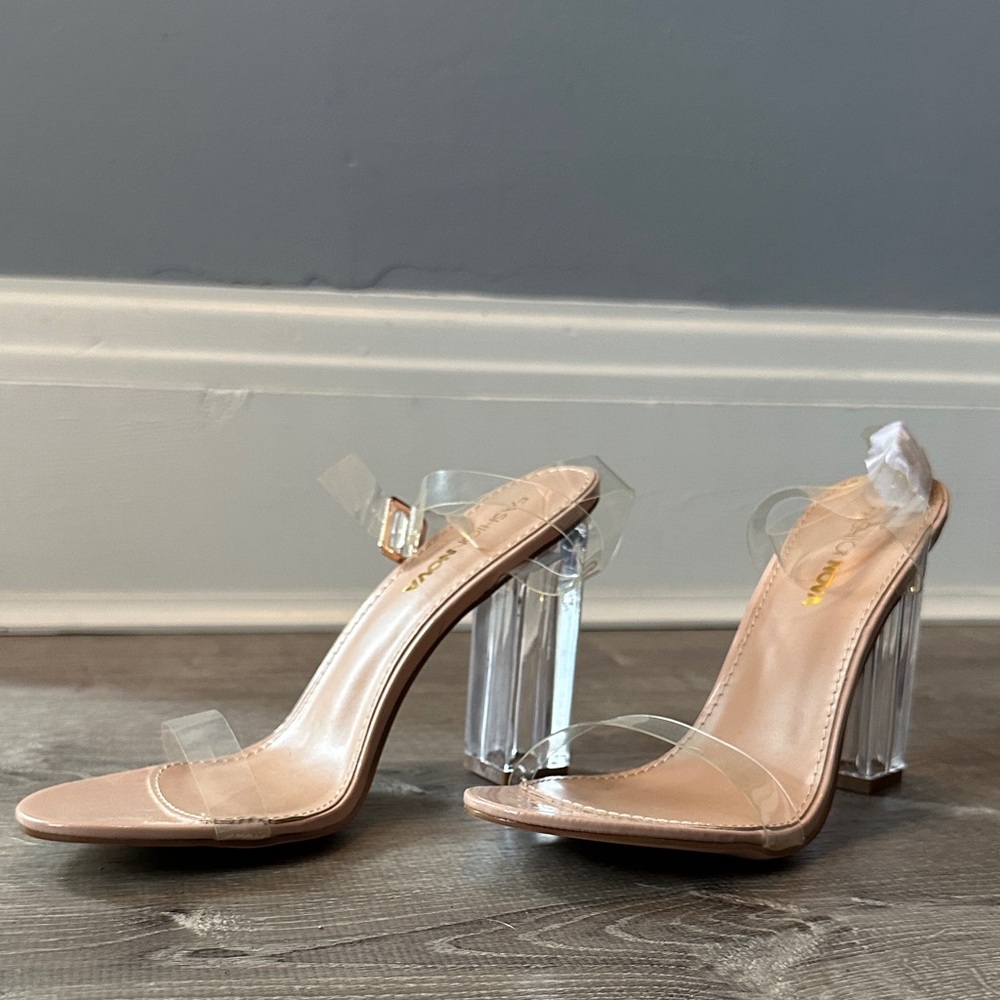 Woman’s Nude and Clear Heels Size 9